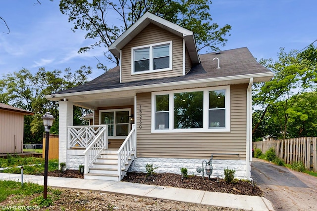 15230 State St, South Holland, IL 60473 - bungalow with a porch and a shingled roof