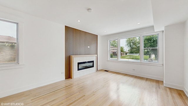 15230 State St, South Holland, IL 60473 - unfurnished living room featuring wood finished floors, a tiled fireplace, and recessed lighting