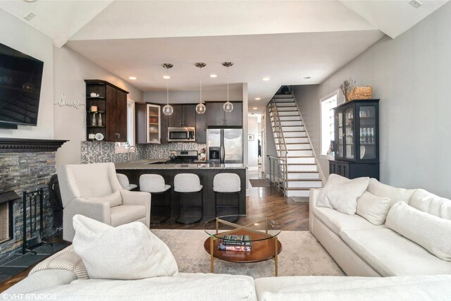 2013 W Rice St Unit 3, Chicago, IL 60622 - living room with dark wood-type flooring, stairway, a fireplace, lofted ceiling, and recessed lighting