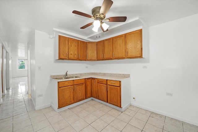 1318 S Kolin Ave, Chicago, IL 60623 - kitchen with light countertops, brown cabinetry, and a ceiling fan