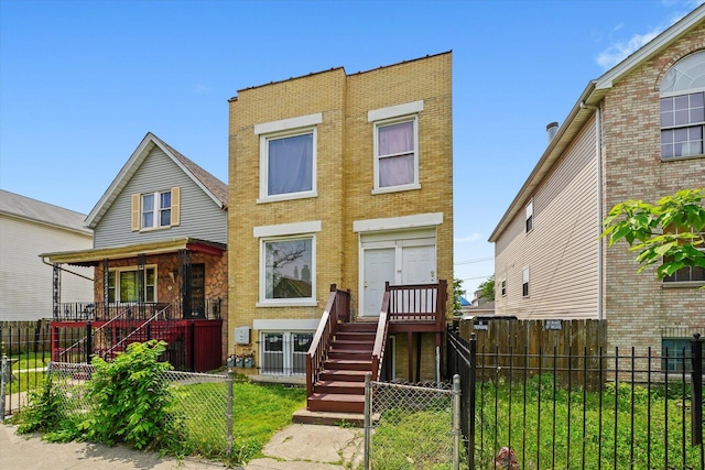 1318 S Kolin Ave, Chicago, IL 60623 - view of front of home featuring a fenced front yard, brick siding, and covered porch