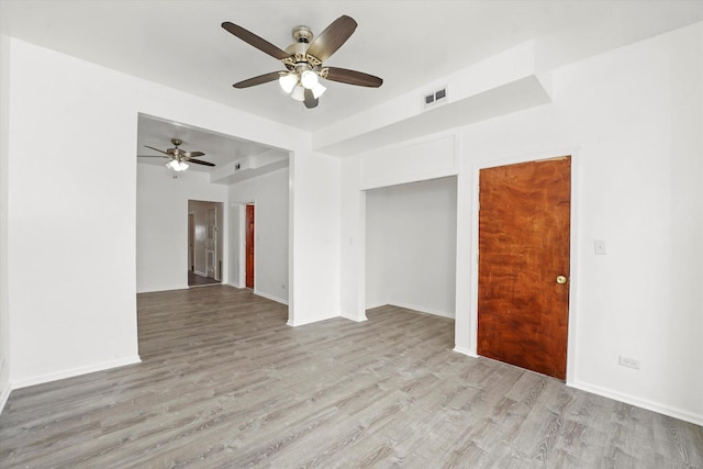 1318 S Kolin Ave, Chicago, IL 60623 - unfurnished room featuring a ceiling fan and light wood-style flooring