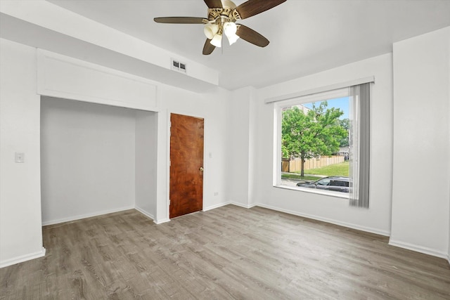 1318 S Kolin Ave, Chicago, IL 60623 - unfurnished bedroom with wood finished floors and a ceiling fan