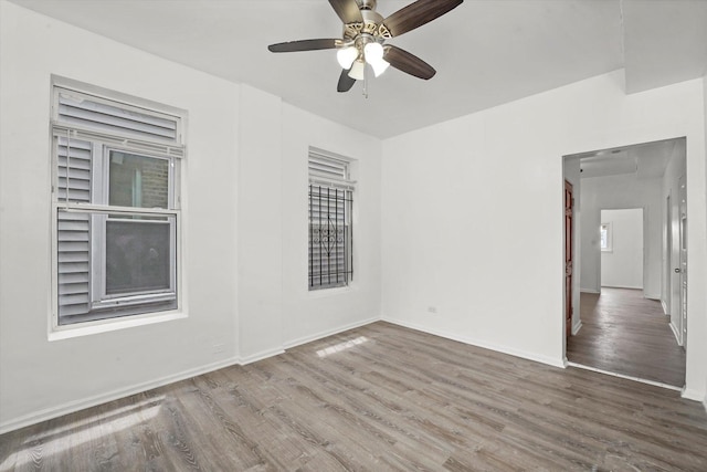 1318 S Kolin Ave, Chicago, IL 60623 - unfurnished room featuring wood finished floors and a ceiling fan
