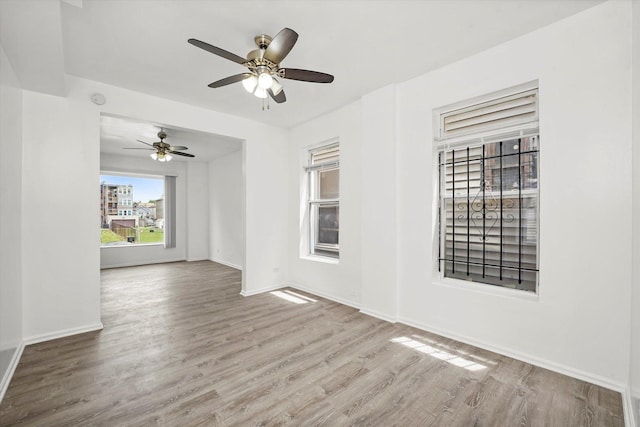 1318 S Kolin Ave, Chicago, IL 60623 - empty room with wood finished floors and ceiling fan