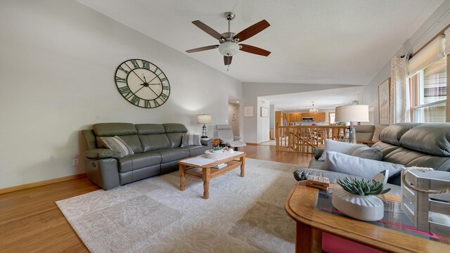 70 Delburne Dr, Davis, IL 61019 - living area featuring vaulted ceiling, ceiling fan, and wood finished floors