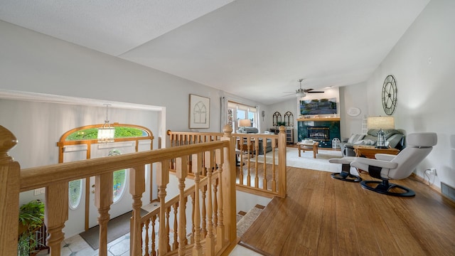 70 Delburne Dr, Davis, IL 61019 - hallway featuring an upstairs landing, wood finished floors, and vaulted ceiling