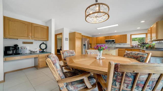 70 Delburne Dr, Davis, IL 61019 - dining area with light tile patterned flooring, a chandelier, and recessed lighting
