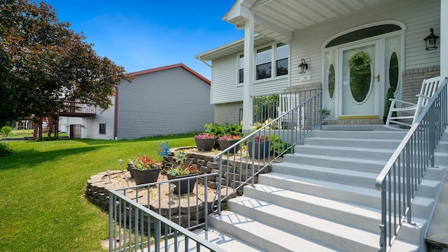 70 Delburne Dr, Davis, IL 61019 - property entrance with brick siding and a yard