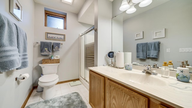 70 Delburne Dr, Davis, IL 61019 - bathroom with a shower stall, vanity, and tile patterned floors