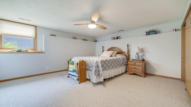 70 Delburne Dr, Davis, IL 61019 - bedroom featuring light colored carpet, a textured ceiling, and ceiling fan