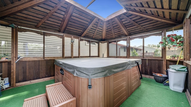 70 Delburne Dr, Davis, IL 61019 - sunroom with a hot tub and vaulted ceiling