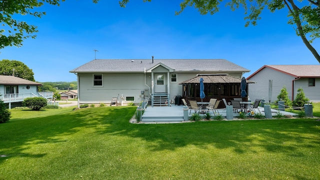 70 Delburne Dr, Davis, IL 61019 - back of property with a gazebo, a patio area, a lawn, and entry steps