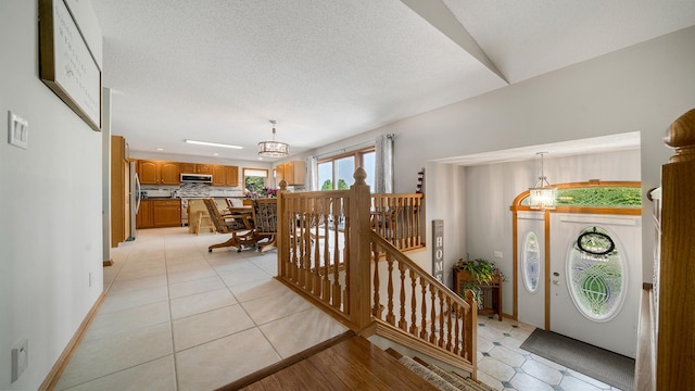70 Delburne Dr, Davis, IL 61019 - foyer with a chandelier and light tile patterned flooring