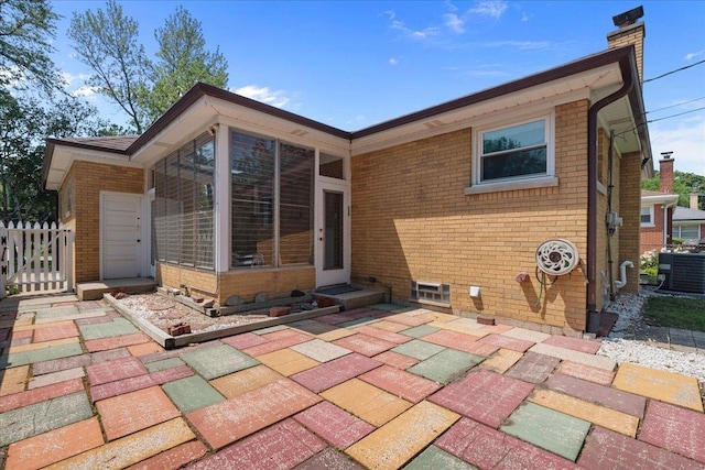 109 N Home Ave, Park Ridge, IL 60068 - rear view of house with brick siding, a chimney, and a patio
