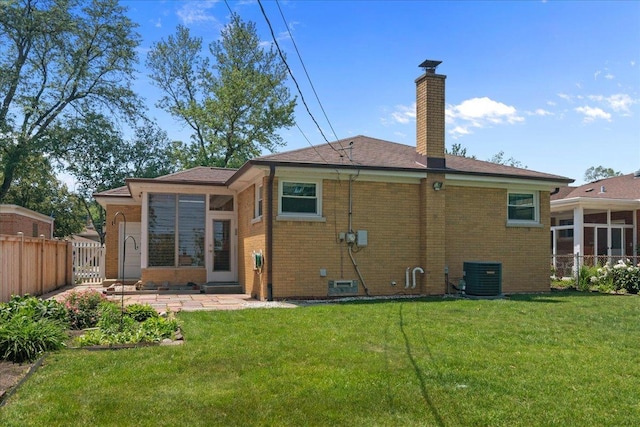109 N Home Ave, Park Ridge, IL 60068 - back of house with brick siding, a chimney, and a patio area