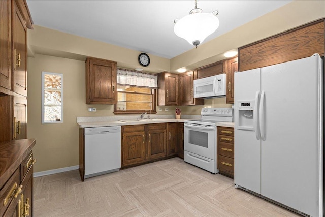 109 N Home Ave, Park Ridge, IL 60068 - kitchen featuring white appliances, light countertops, and pendant lighting