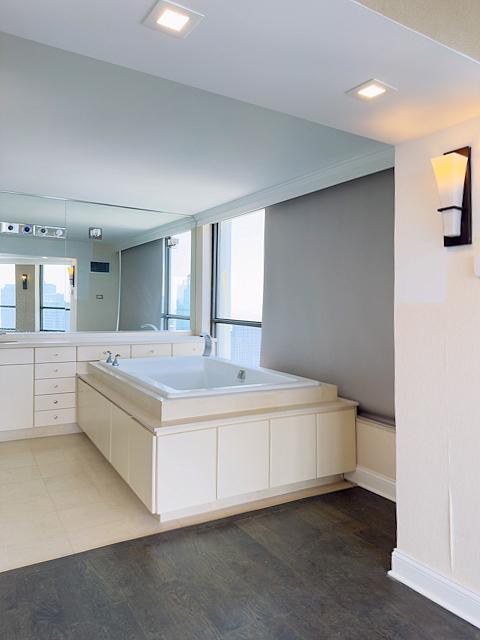 405 N Wabash Ave Unit 5109, Chicago, IL 60611 - full bathroom featuring wood finished floors, a bath, and vanity
