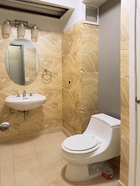 405 N Wabash Ave Unit 5109, Chicago, IL 60611 - half bathroom featuring a sink and tile patterned flooring