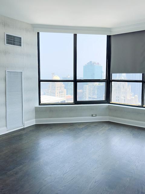 405 N Wabash Ave Unit 5109, Chicago, IL 60611 - empty room featuring dark wood-type flooring and plenty of natural light
