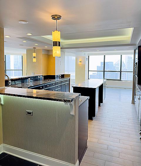 405 N Wabash Ave Unit 5109, Chicago, IL 60611 - kitchen with a spacious island, a raised ceiling, and decorative light fixtures