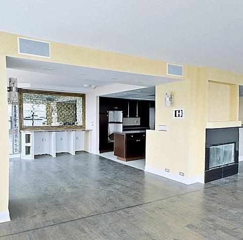 405 N Wabash Ave Unit 5109, Chicago, IL 60611 - unfurnished living room featuring a glass covered fireplace and baseboards