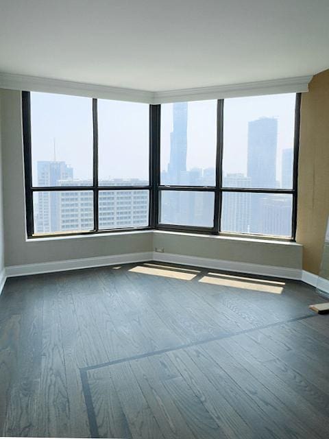 405 N Wabash Ave Unit 5109, Chicago, IL 60611 - spare room featuring baseboards and wood finished floors