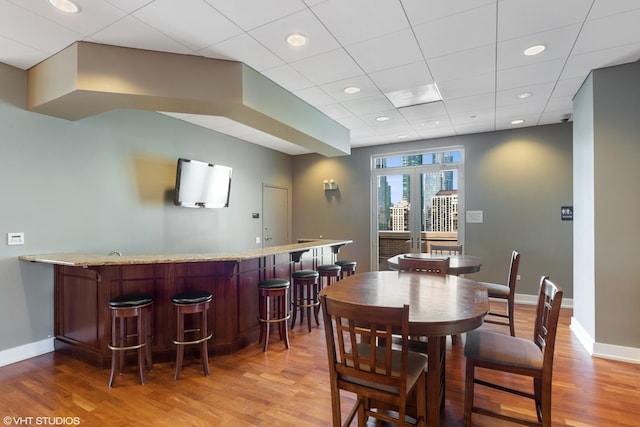 1515 S Prairie Ave Unit 715, Chicago, IL 60605 - dining space with wet bar, wood finished floors, and a drop ceiling