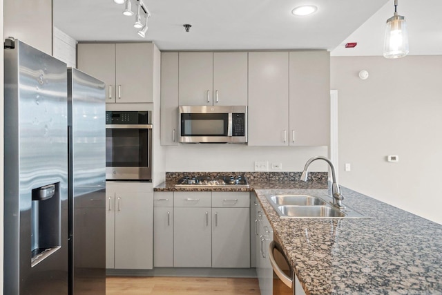 1515 S Prairie Ave Unit 715, Chicago, IL 60605 - kitchen with appliances with stainless steel finishes, gray cabinets, a peninsula, light wood-style flooring, and hanging light fixtures