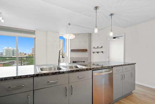 1515 S Prairie Ave Unit 715, Chicago, IL 60605 - kitchen featuring dishwasher, light wood finished floors, healthy amount of natural light, and dark stone countertops