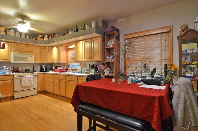 1014 Walnut St, Ottawa, IL 61350 - kitchen with white appliances, a ceiling fan, light brown cabinetry, light wood-type flooring, and light countertops