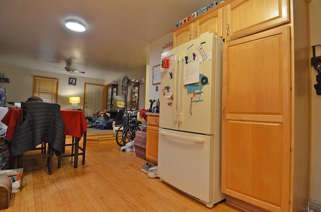 1014 Walnut St, Ottawa, IL 61350 - kitchen featuring freestanding refrigerator, ceiling fan, open floor plan, and light wood finished floors