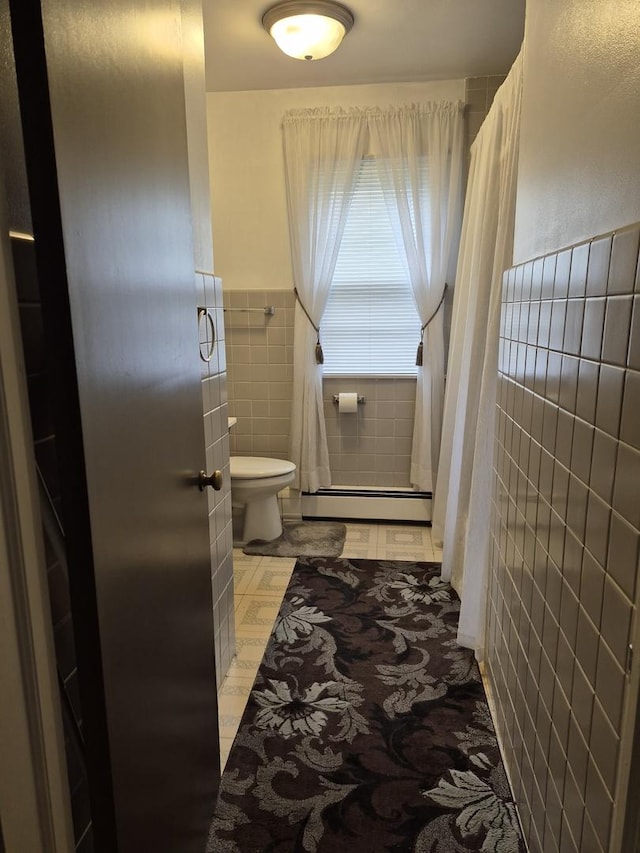 616 E Prairie Ave, Des Plaines, IL 60016 - bathroom with a baseboard radiator, tile walls, and wainscoting