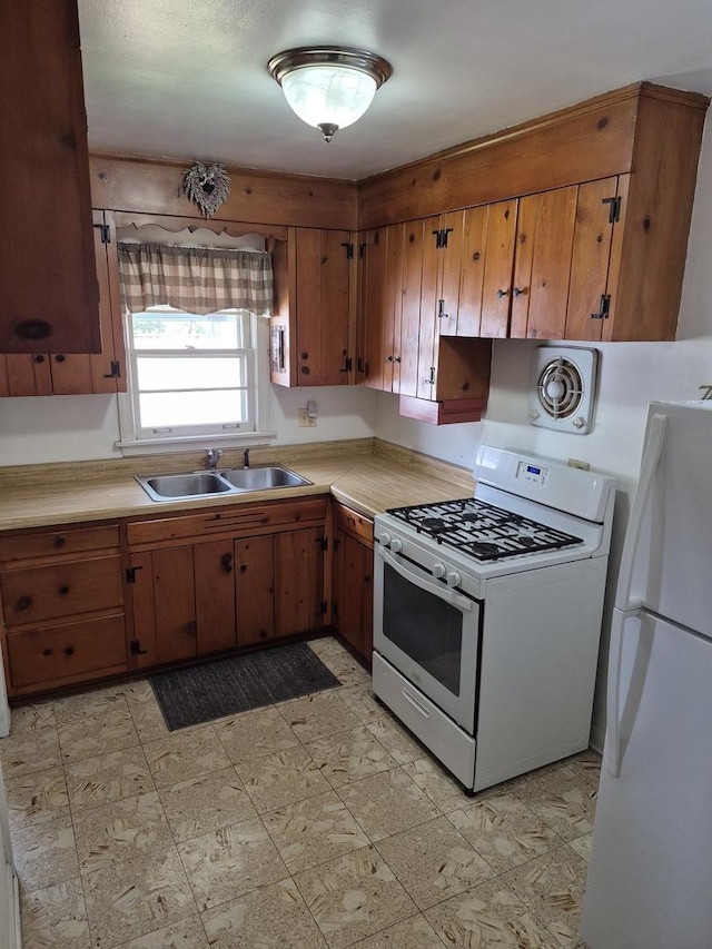 616 E Prairie Ave, Des Plaines, IL 60016 - kitchen with white appliances, light countertops, brown cabinetry, and light flooring