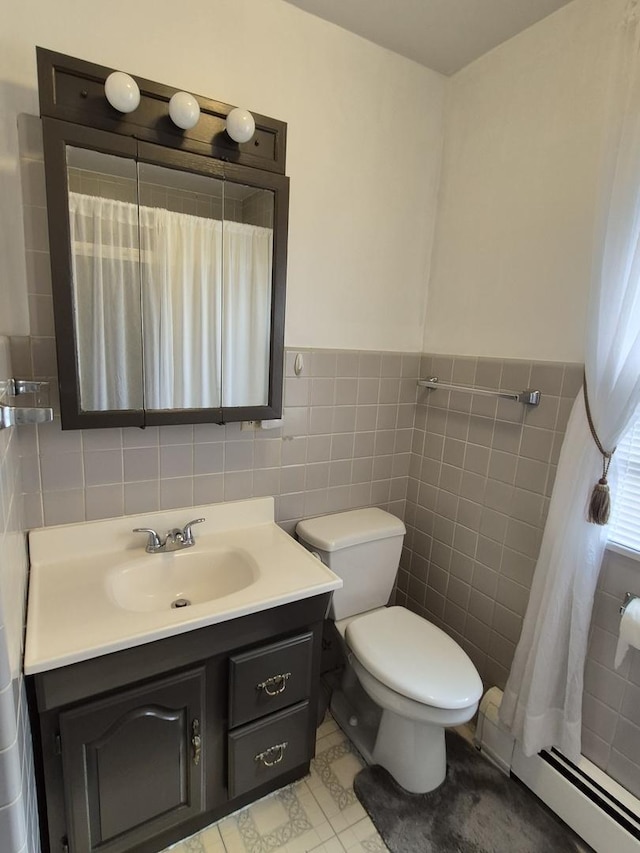 616 E Prairie Ave, Des Plaines, IL 60016 - full bathroom featuring tile walls, a baseboard radiator, vanity, wainscoting, and a shower with curtain