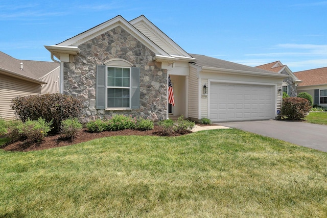 11768 Chatfield Xing, Huntley, IL 60142 - ranch-style house with stone siding, an attached garage, driveway, and a front yard