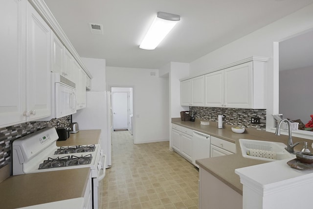11768 Chatfield Xing, Huntley, IL 60142 - kitchen with white appliances, light flooring, backsplash, white cabinets, and a peninsula