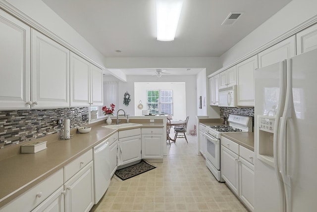 11768 Chatfield Xing, Huntley, IL 60142 - kitchen with white appliances, a peninsula, white cabinets, ceiling fan, and backsplash