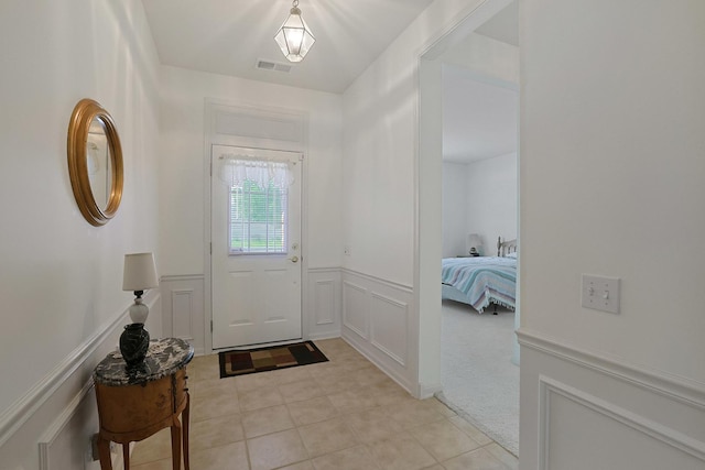 11768 Chatfield Xing, Huntley, IL 60142 - entrance foyer featuring a decorative wall, light tile patterned floors, and a wainscoted wall