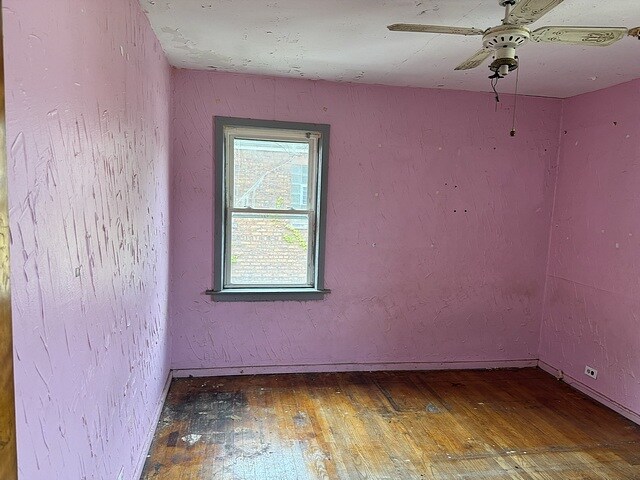 10750 S Ridgeway Ave, Chicago, IL 60655 - spare room with wood-type flooring and a ceiling fan