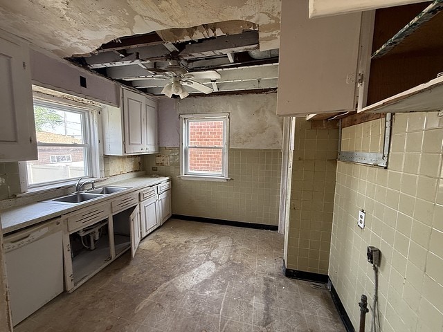10750 S Ridgeway Ave, Chicago, IL 60655 - kitchen with white dishwasher, healthy amount of natural light, light countertops, ceiling fan, and tile walls