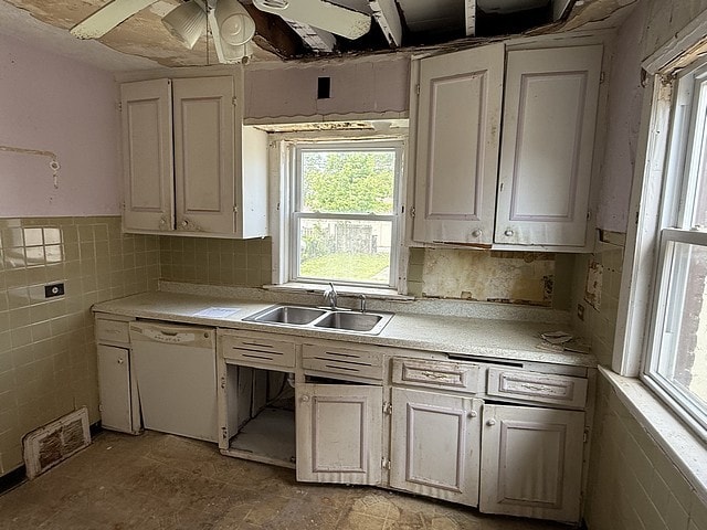 10750 S Ridgeway Ave, Chicago, IL 60655 - kitchen featuring white dishwasher, light countertops, a ceiling fan, white cabinets, and tile walls