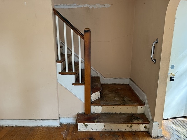 10750 S Ridgeway Ave, Chicago, IL 60655 - stairway featuring hardwood / wood-style flooring and arched walkways