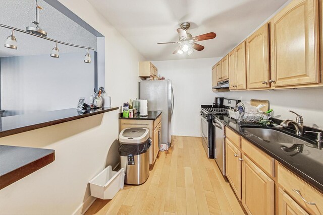 6700 S S Shore Dr Unit 17B, Chicago, IL 60649 - kitchen featuring light brown cabinets, stainless steel appliances, a ceiling fan, dark countertops, and light wood-style flooring