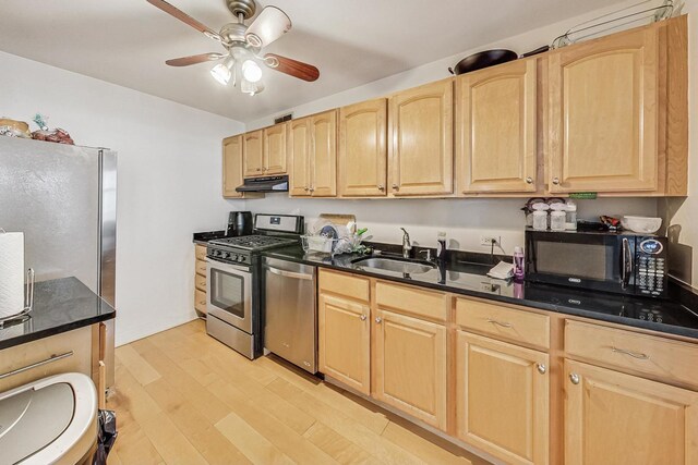 6700 S S Shore Dr Unit 17B, Chicago, IL 60649 - kitchen featuring appliances with stainless steel finishes, light brown cabinetry, light wood-type flooring, ceiling fan, and range hood