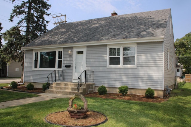 1001 Wilcox St, Joliet, IL 60435 - cape cod house with a front lawn, roof with shingles, and a chimney