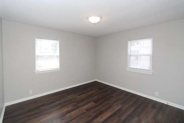 1001 Wilcox St, Joliet, IL 60435 - empty room featuring plenty of natural light and dark wood-style floors