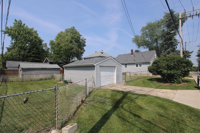 1001 Wilcox St, Joliet, IL 60435 - view of property exterior featuring driveway, a garage, a fenced backyard, and an outbuilding