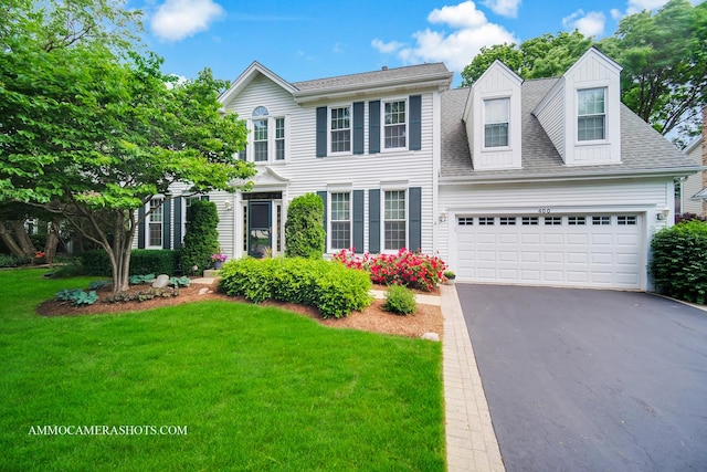 400 Adare Dr, Cary, IL 60013 - colonial-style house with driveway, a front lawn, a garage, and a shingled roof