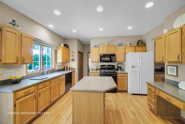 400 Adare Dr, Cary, IL 60013 - kitchen with black appliances, decorative backsplash, light wood-style floors, a kitchen island, and recessed lighting